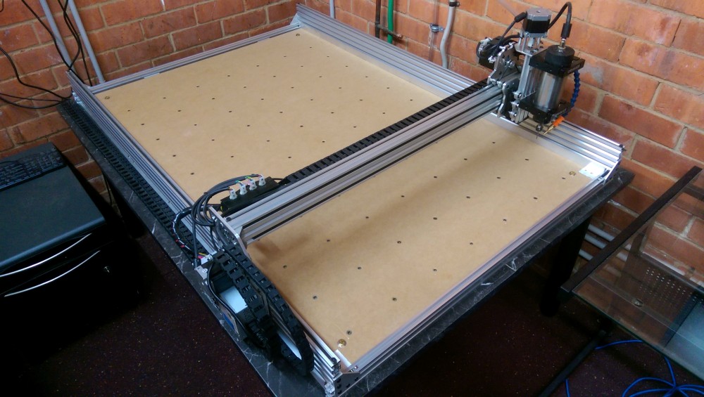 Photo of CNC bed with threaded inserts
